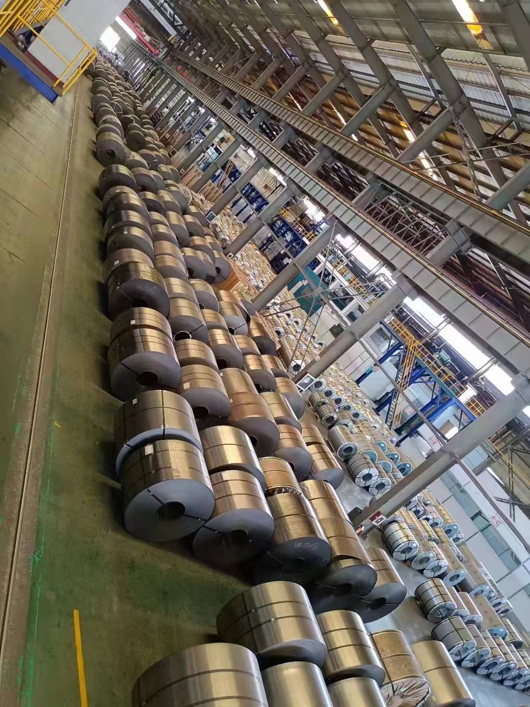 Strapped and labeled PPGI and PPGL coils ready for export packaging at Camasteel partner facility