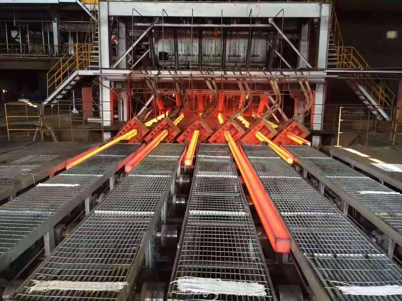  Manufacturing of a large stack of steel billets in a bright, modern industrial warehouse.