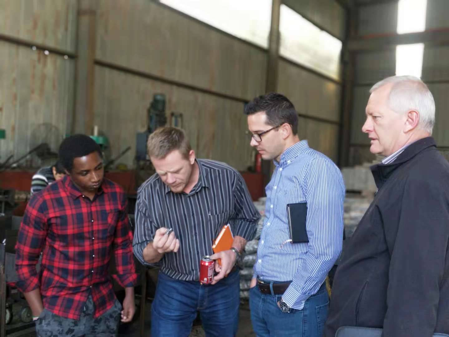 International buyers conducting detailed inspection at Chinese steel factory
