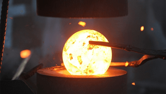 Forged steel balls being inspected at Camasteel's factory in China